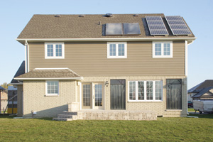 SUN POWER: Solar collectors from Concord-based company, Your Solar Home, are embedded in the wall on the back of an enviro home in Windsor, Ont. Photo courtesy Your Solar Home